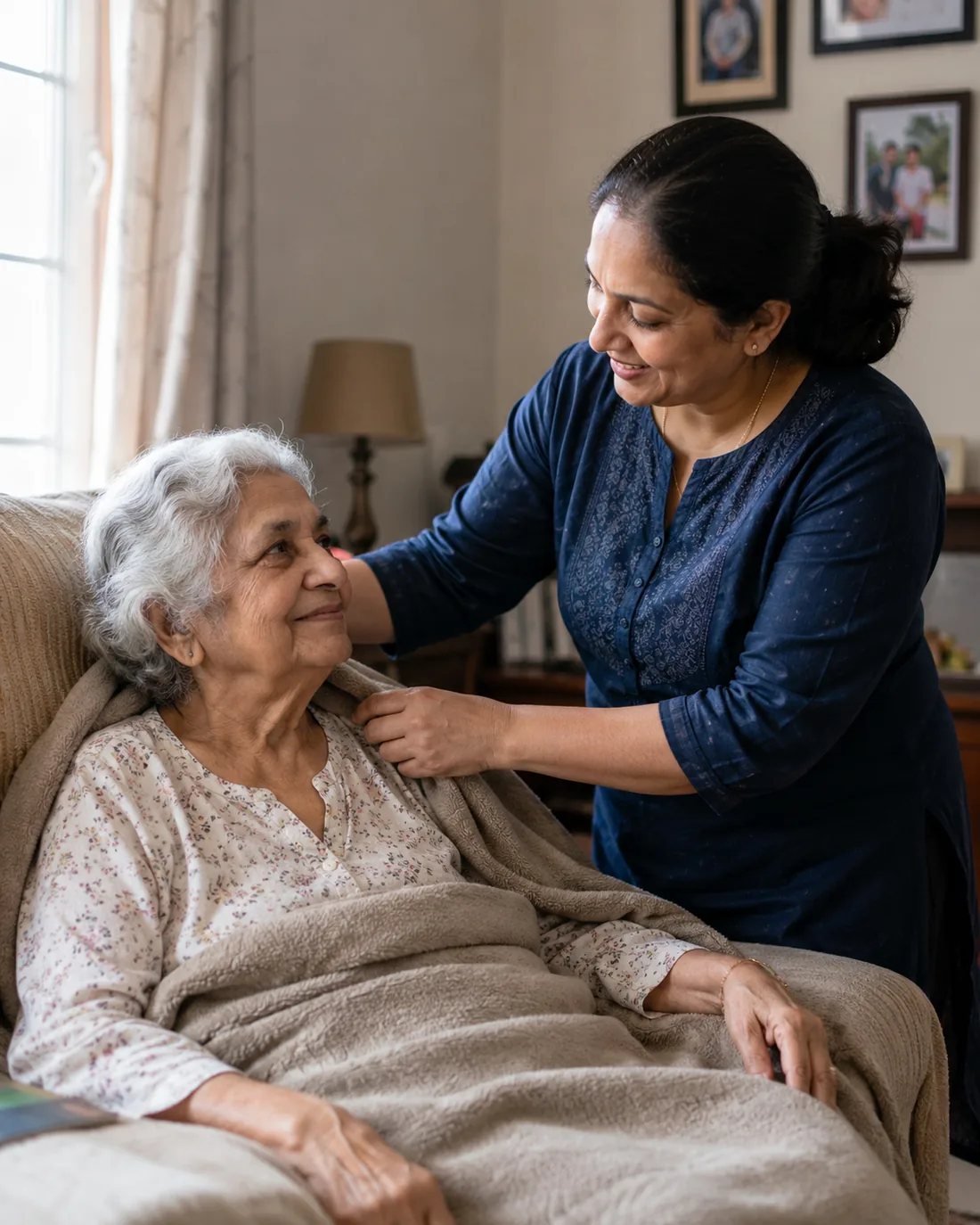 A Juniper Home Care caregiver sitting with a senior client at home